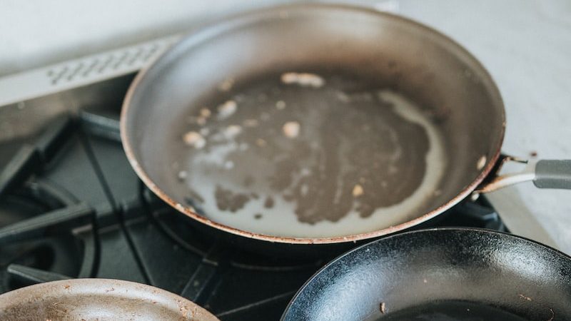 black frying non stick pan on stove
