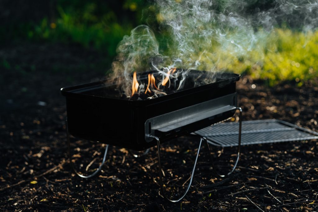 Small griddle with burning charcoal