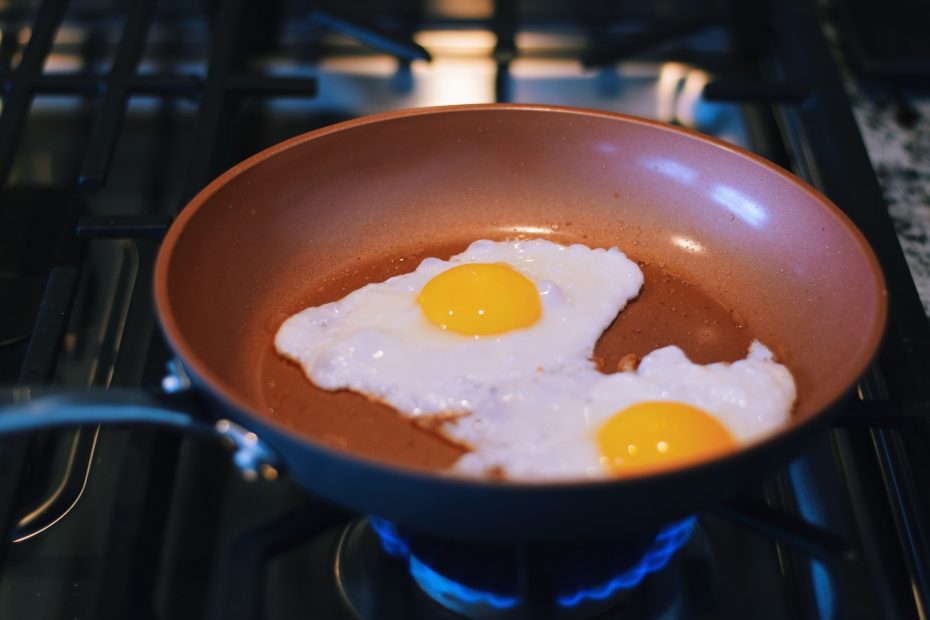 Sunny side up eggs frying on a non stick pan